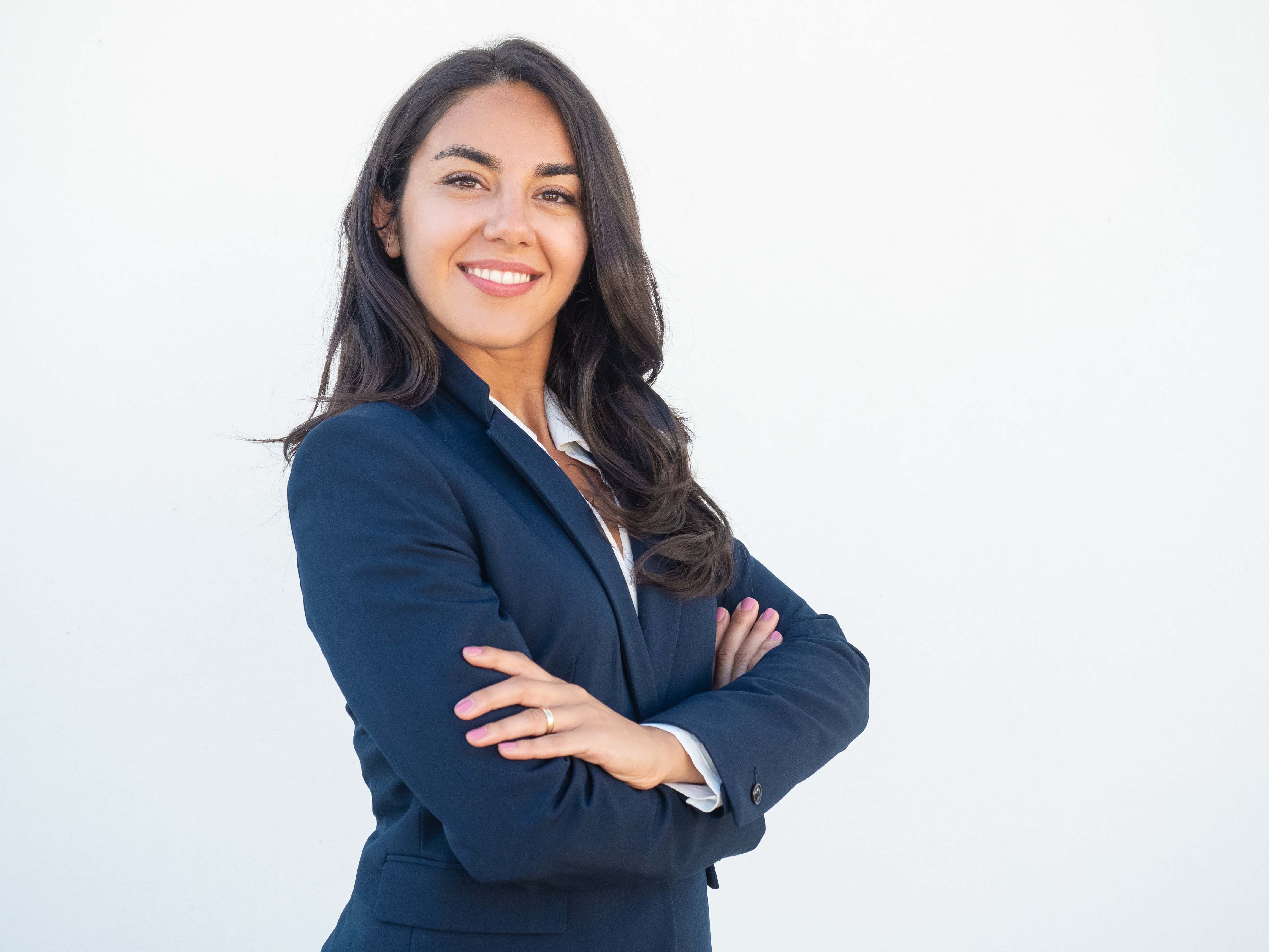 smiling-confident-businesswoman-posing-with-arms-folded